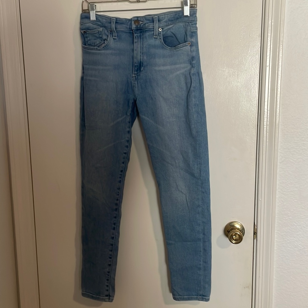 Women’s light wash high rise skinny jean.